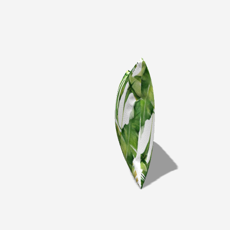 Palm Cotton Lumbar Pillow with green palm leaf design angled to showcase texture and vibrant colors.